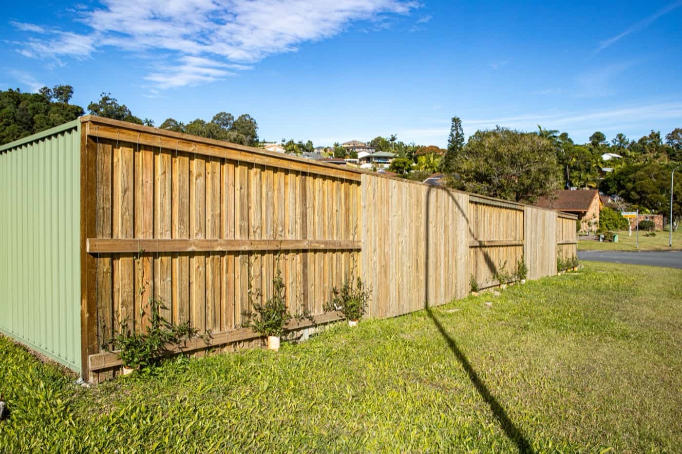 New timber paling fence with capping on a corner block